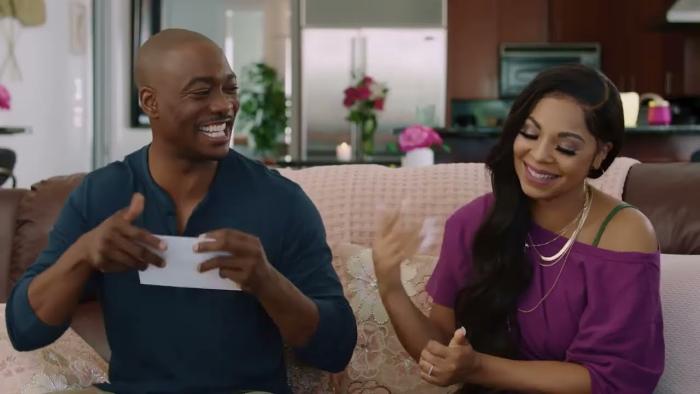 The Plus One Movie: B.J. Britt and Ashanti smile as they seal invitation envelopes
