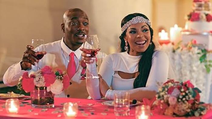 The Plus One Movie: B.J. Britt and Ashanti smile during the wedding dinner