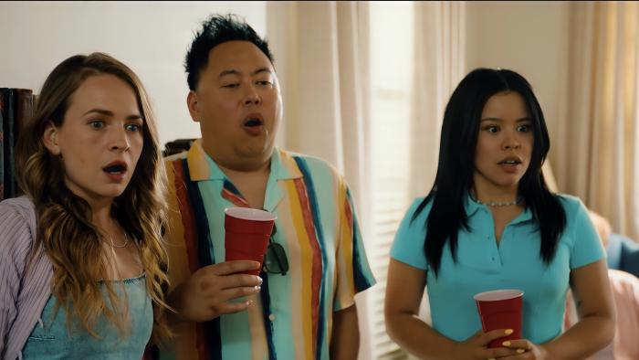 The Re-Education of Molly Singer Movie: Three young people holding Solo cups at a party look at something in shock