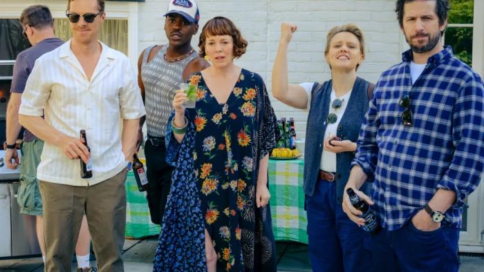 The Roses movie: Several of the characters stand together, looking at something