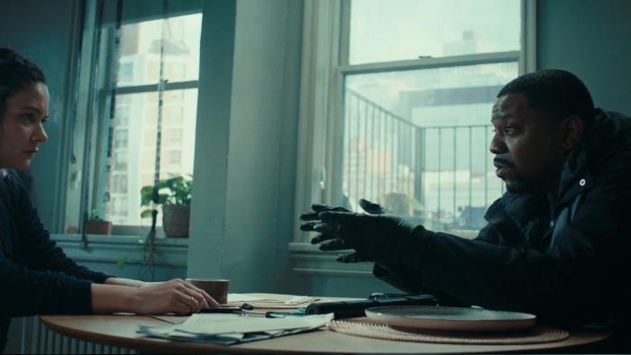 The Silent Hour: Sandra Mae Frank and Mekhi Phifer sit at a table in an apartment room next to some windows