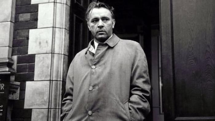The Spy Who Came in from the Cold: Richard Burton stands in doorway wearing overcoat