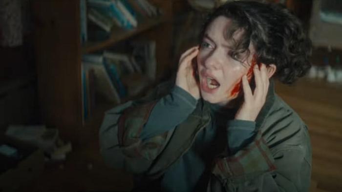The Unheard: Chloe plugs her ears and looks scared. 