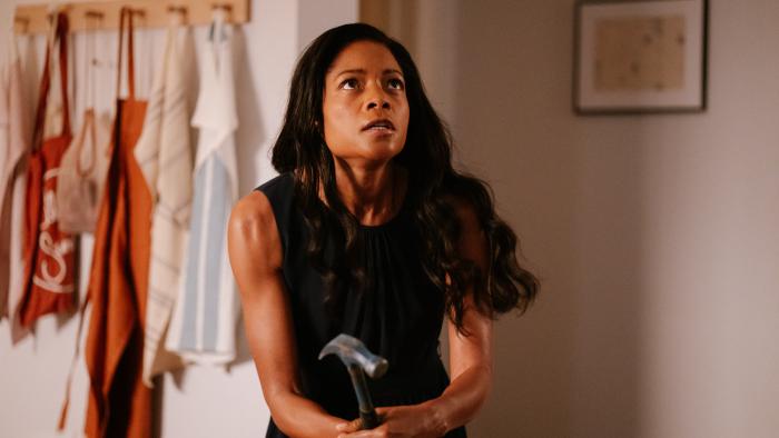 The Wasp Movie: Naomie Harris holds a hammer, ready to attack something above her