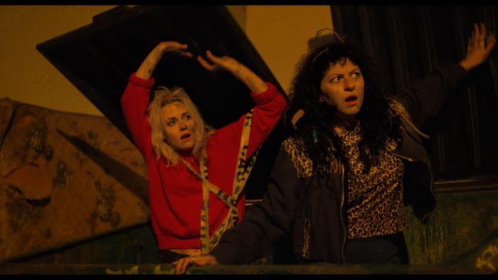 The Wrong Girls movie: Kristen Stewart and Alia Shawkat emerge from inside a Dumpster
