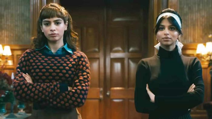 The Archies: Betty and Veronica sit with their arms crossed.