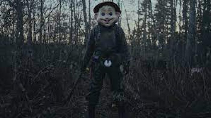 The Conference scene 3: Tall creepy smiling creature standing tall outside