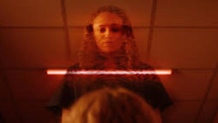 The Correction Unit: Woman with red background
