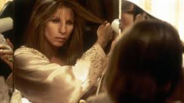 The Mirror has Two Faces: Barbra Streisand blow-dries her hair