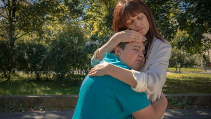 mother hugging son