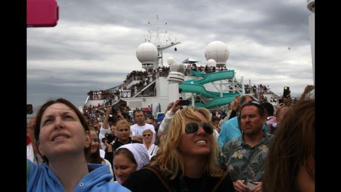 Trainwreck: Poop Cruise movie: Passengers on the Carnival Triumph flood the top deck trying to get phone signals