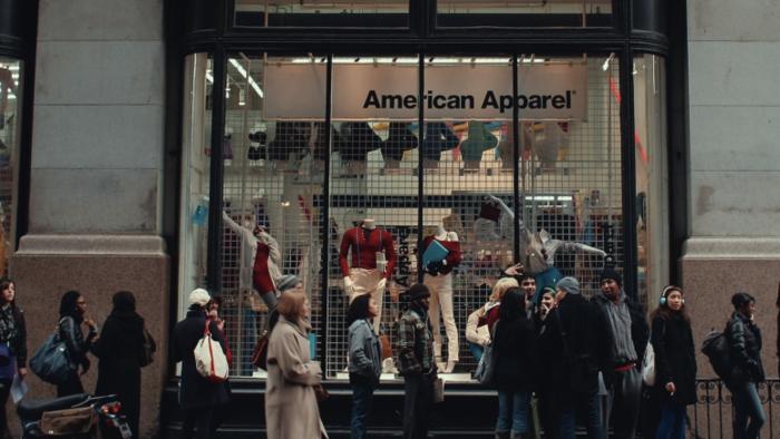 Trainwreck: The Cult of American Apparel movie: Customers line up outside an American Apparel store, mannequins display in the window behind them
