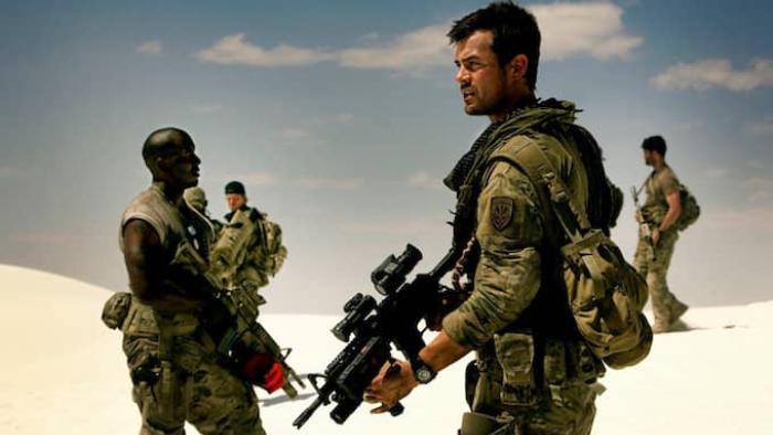 Transformers Movie: Captain Lennox holds an assault rifle