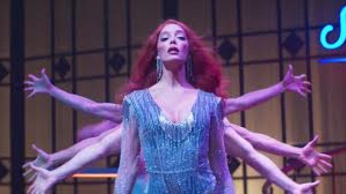 Transmitzvah: A woman performs with hands behind her