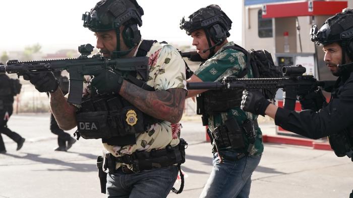 Trap House Movie: Wearing helmets and raid gear and carrying rifles, Ray and Andre prepare to invade a drug den