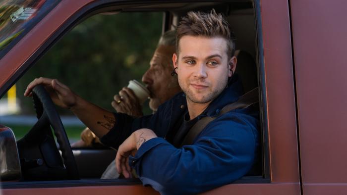 Tuner movie: Leo Woodall smiles from the driver's seat of a van, while Dustin Hoffman sips coffee in the passenger seat