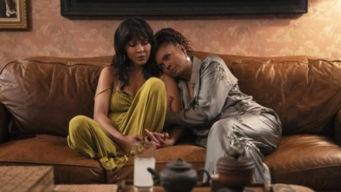 Tyler Perry's Divorce in the Black movie: Meagan Good and Debbi Morgan sit close together on a couch