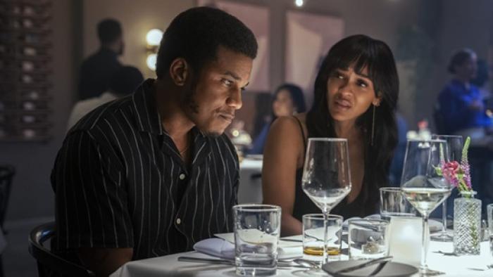 Tyler Perry's Divorce in the Black movie: Meagan Good and Cory Hardrict at dinner, looking concerned