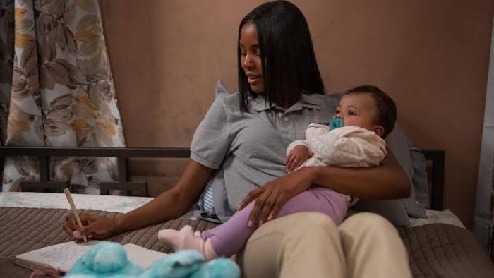 Tyler Perry’s Doing Life: Naomi Baker holds a baby.