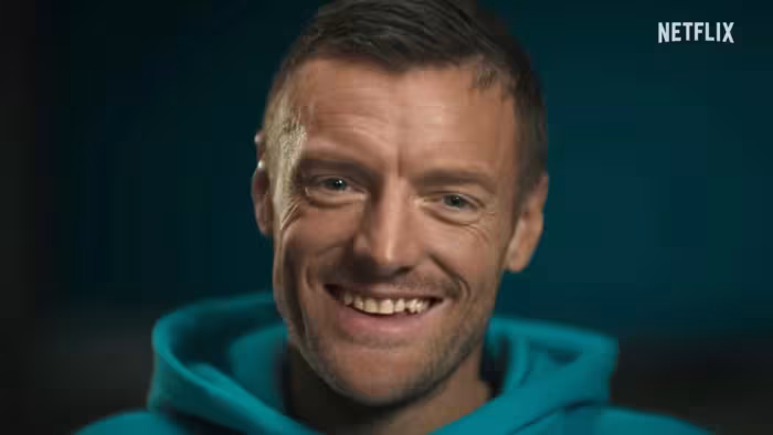 UK Untold: Jamie Vardy: Jamie Vardy smiling in a blue hoodie against a dark background