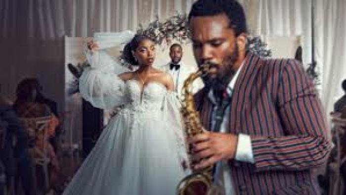 Umjolo: My Beginning, My End!: Black man and woman in wedding dress