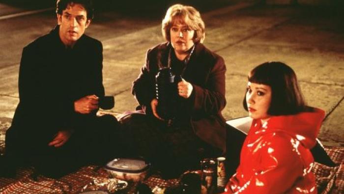 Unconditional Love: Rupert Everett, Kathy Bates, and Meredith Eaton sit together on a picnic blanket in an underground space