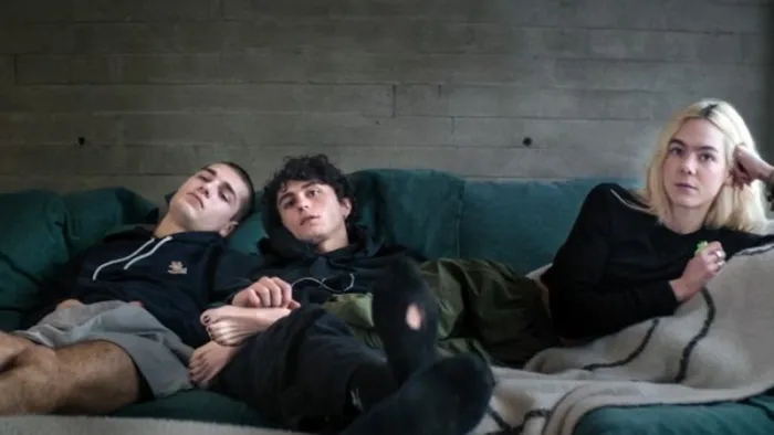 Untamed Royals: Teens relax on a couch.