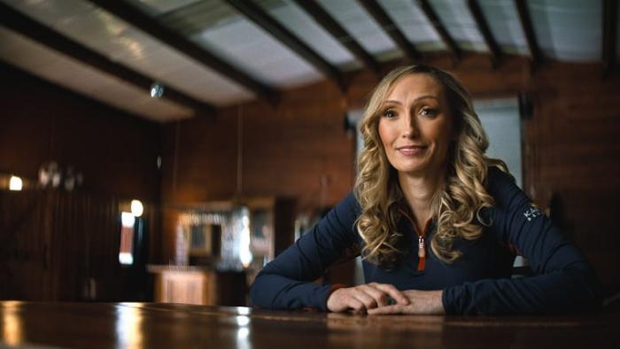 Untold: The Shooting at Hawthorne Hill movie: Lauren Kanarek sits at a table with hands together on table
