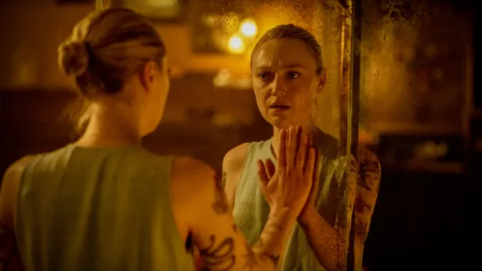 Vicious: Dakota Fanning talks to herself in the mirror.