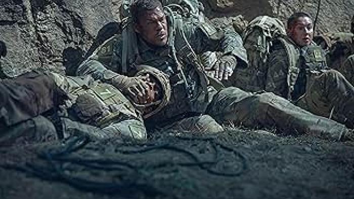 War Machine: Rangers hide by a cliff.