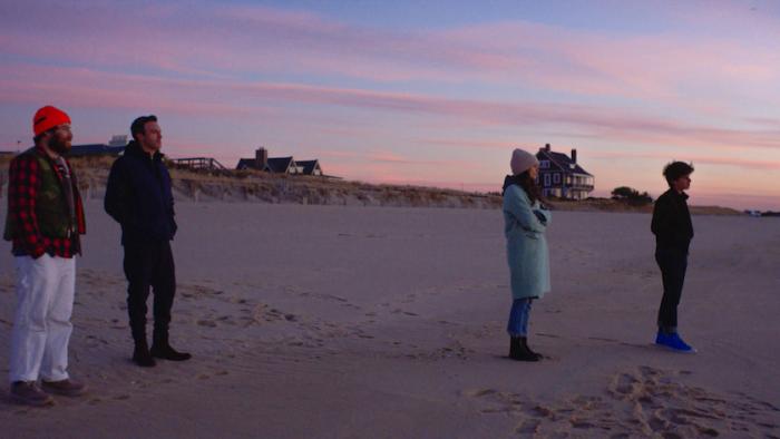 Who Invited Charlie? Movie: Charlie, Phil, Rosie, and Max stand on the beach at sunset