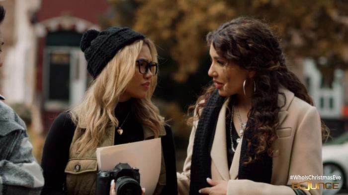 Two women in earnest conversation walking outdoors.