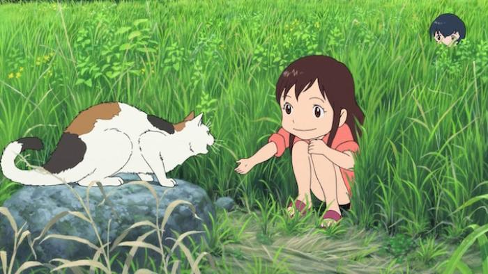 Wolf Children Movie: A young girl squats and holds her hands out to a hissing calico cat in tall grass