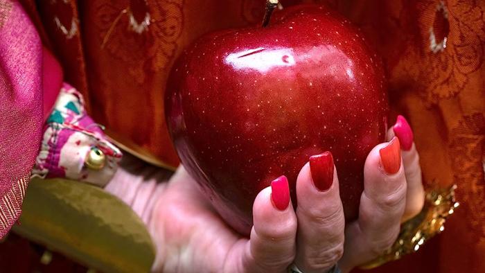 Wonderwell Movie: Carrie Fisher's hand shown holding a red apple