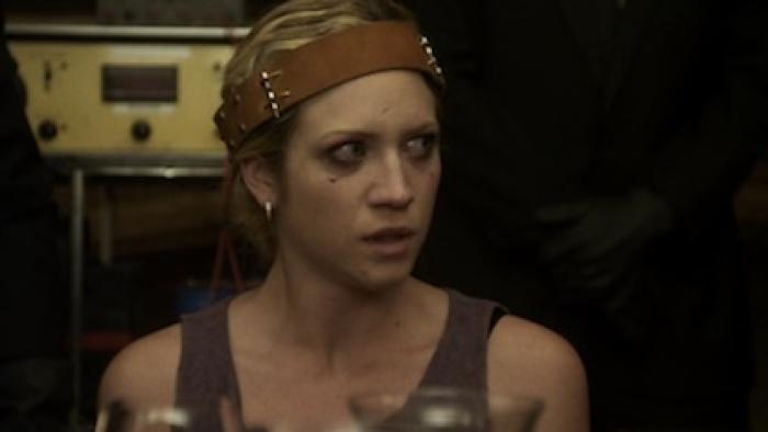 Would You Rather: Woman with headband looks worried in dimly-lit room