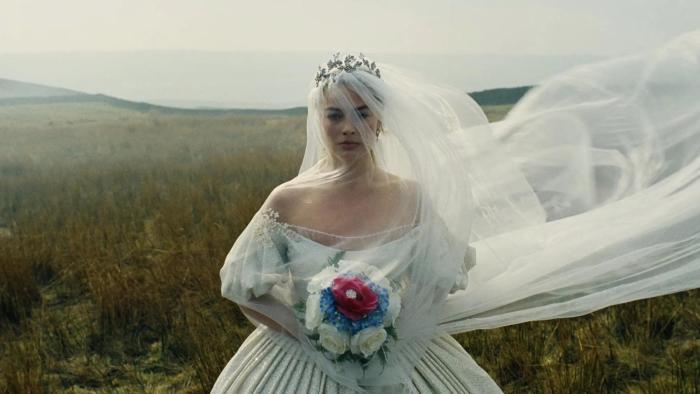 Wuthering Heights movie: Cathy (Margot Robbie) walks through the moors wearing a wedding dress