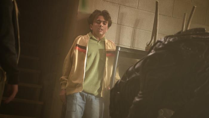 Xeno movie: Trae Romano is backed up against the wall in fear of a giant alien creature