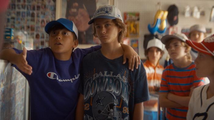 You Gotta Believe Movie: Two Little League teammates stand together, the rest of the team behind them