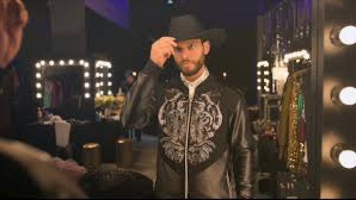 Zero to Hero:  Man in dressing room with a cowboy hat