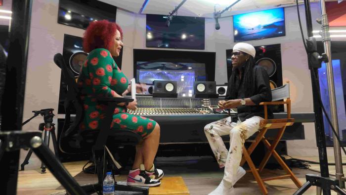  The 1619 Project TV show: Nikole Hannah-Jones interviews someone in a music studio.