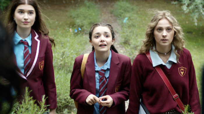 A Kind of Spark screenshot 2: Nina, Adie, and Keedie in maroon school uniform jackets facing forward and looking up. 
