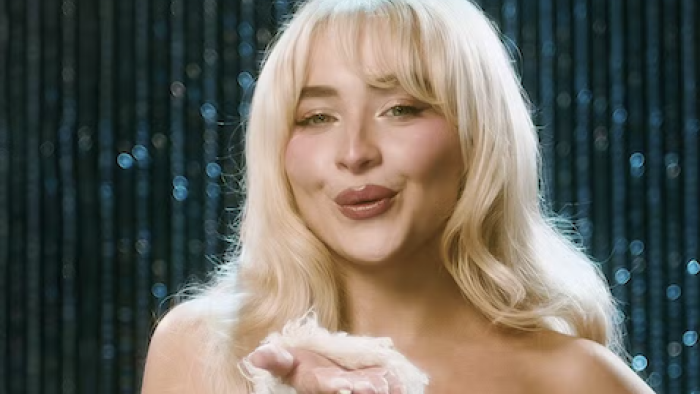A Nonsense ChristmaA Nonsense Christmas with Sabrina Carpenter TV show screenshot 1: Sabrina Carpenter throws kiss to camera. 
