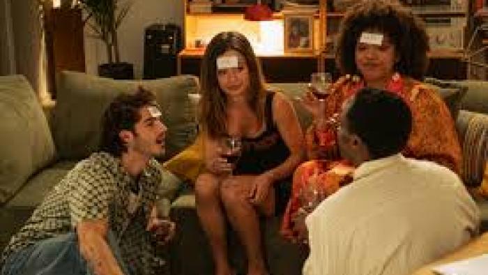 A Perfect Story TV show screenshot #3: A group of four young people play a game in a living room