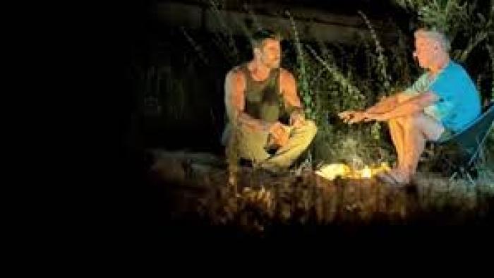A Road Trip to Remember TV show screenshot #1: Father and son sit at a campfire