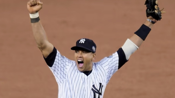 Alex vs ARod TV show screenshot 3: Alex Rodriguez wearing Yankees uniform holding arms upduring game