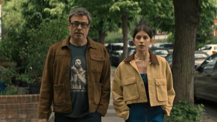 Alice and Steve TV show screenshot 2: Steve and Izzy walk along a city street; they appear to be having a serious discussion but are dressed casually