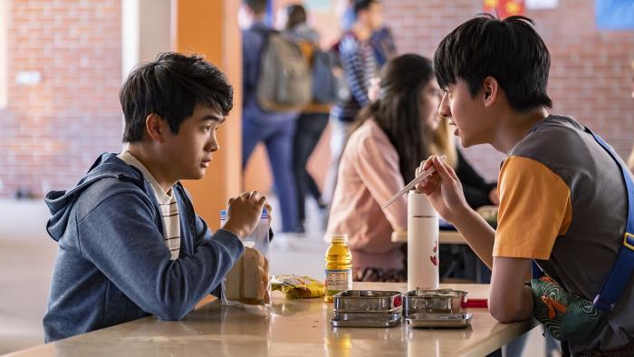 American Born Chinese TV: Chinese teen boys Jin and Wei-Chen sit at a high school cafeteria table
