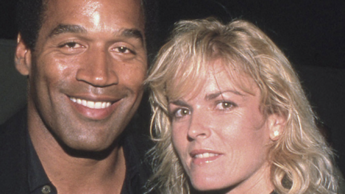 American Manhunt: O.J. Simpson TV show screenshot 1: O.J. Simpson stands close to Nicole Brown.