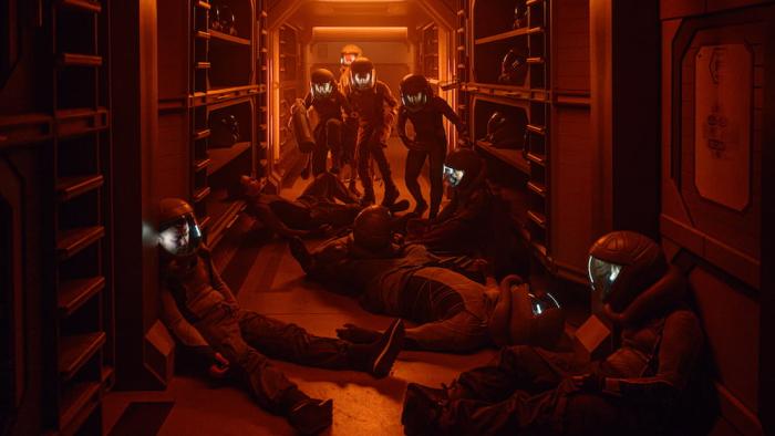The Ark TV show screenshot 3: bodies in spacesuits lay about in the glow of orange light