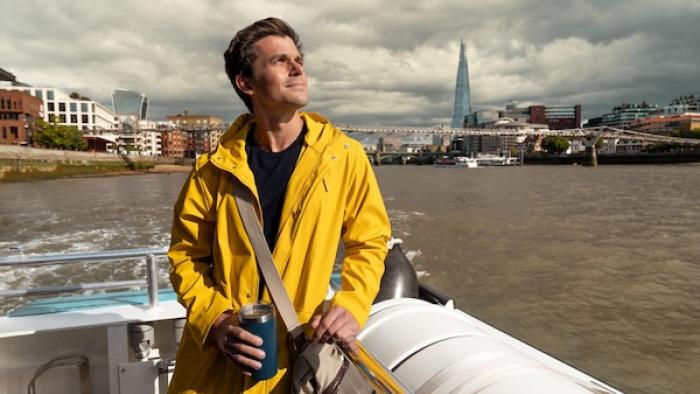 Best of the World with Antoni Porowski: Porowski stands on a boat with the London skyline behind him